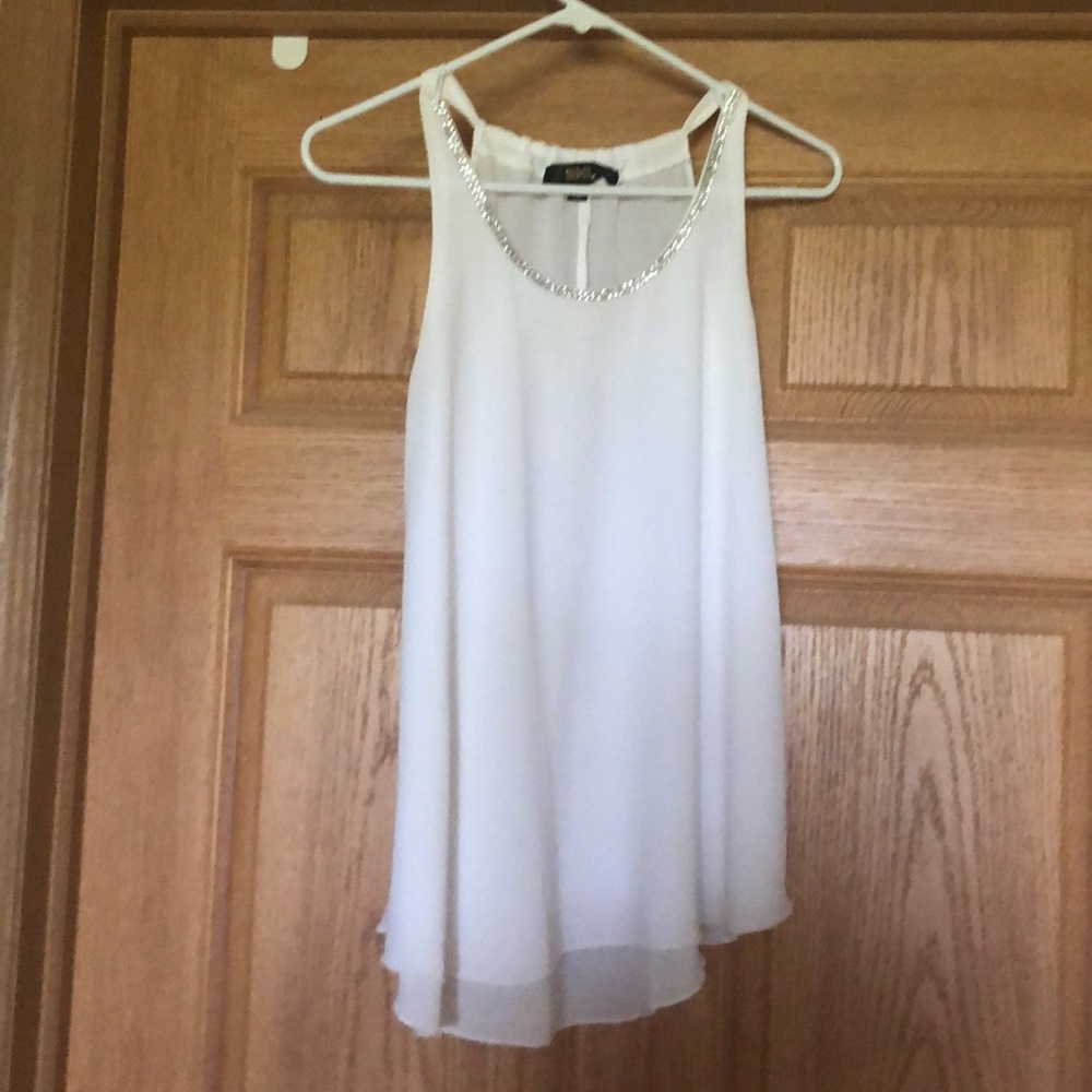 White flowing blouse with rhinestone collar